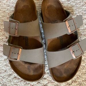 Birkenstock Arizona Stone Earthy Tan Sandals with copper color buckles